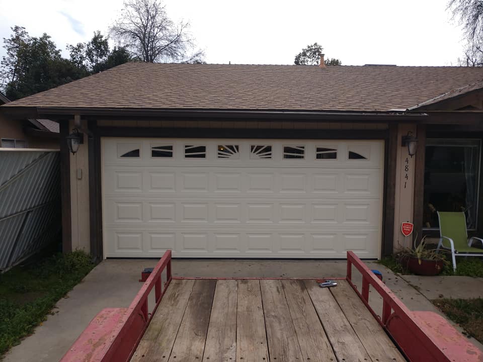 Flawlessly operating garage door after comprehensive spring repair by local experts in visalia