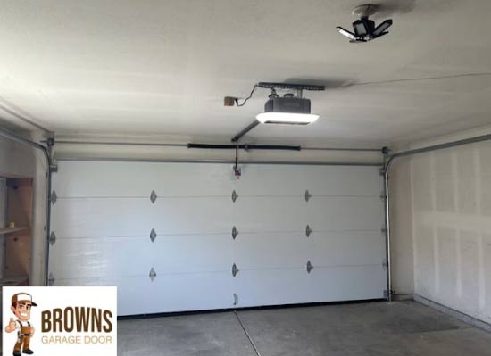 Repaired garage door spring mechanism ensuring smooth, quiet, and reliable door movement.